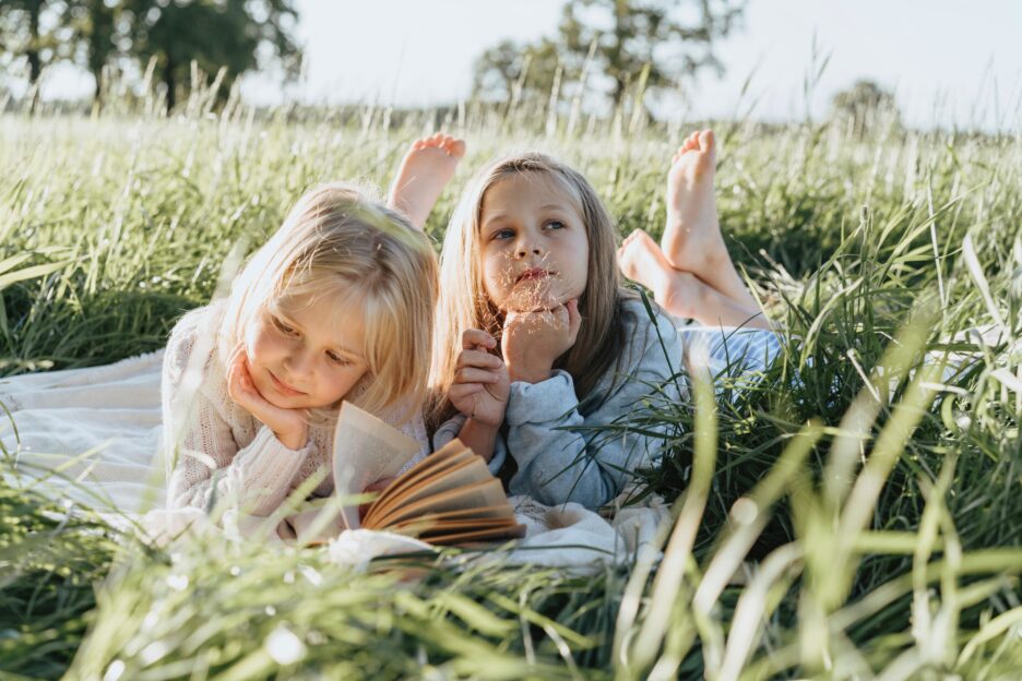 kids lying in the grass