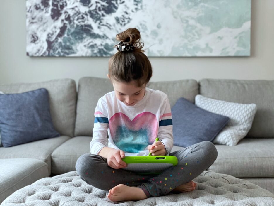 Girl playing on Leap Frog Tablet