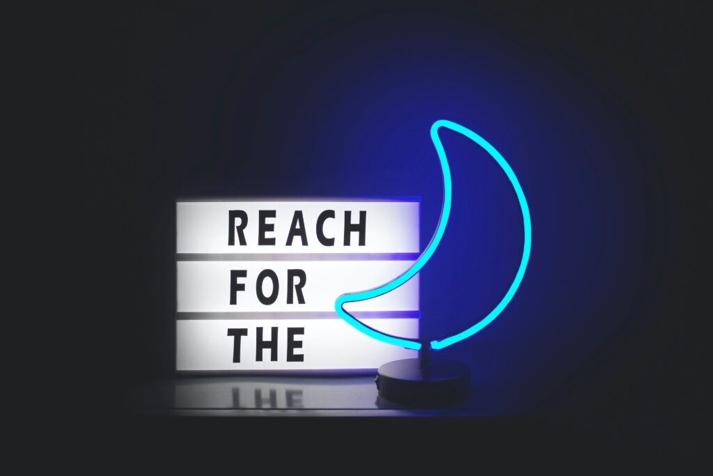 letter board "reach for the moon"