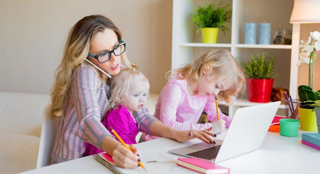 Mom on the computer with children